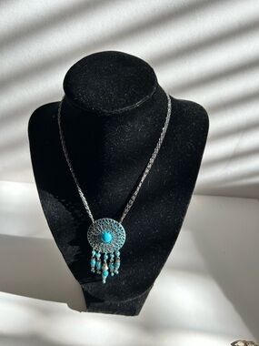vintage Avon "Southwest Style" silver-tone pendant necklace featuring blue bead